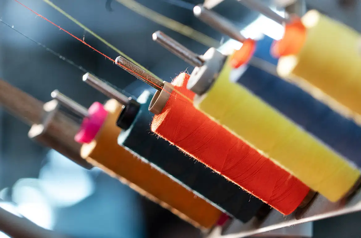 Sewing threads for flame-resistant protective workwear production